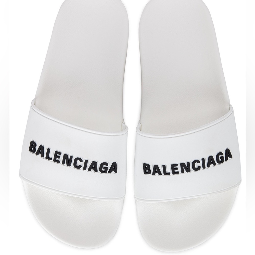 BALENCIAGA
Rubber Logo Pool Slides in White & Black